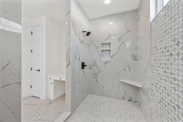 bathroom featuring a tile shower