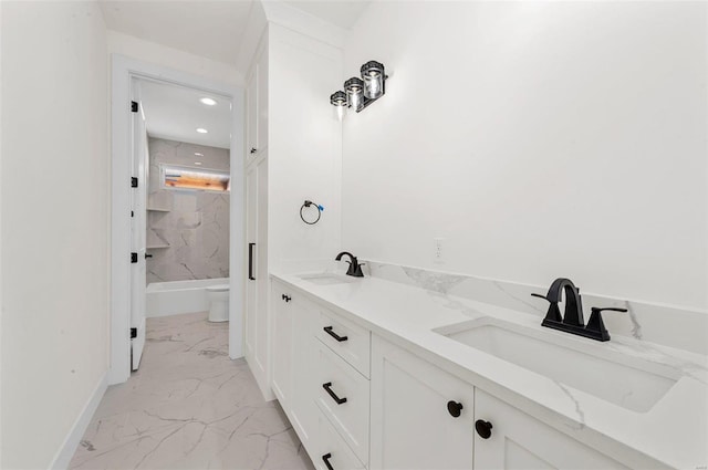 bathroom with toilet and vanity