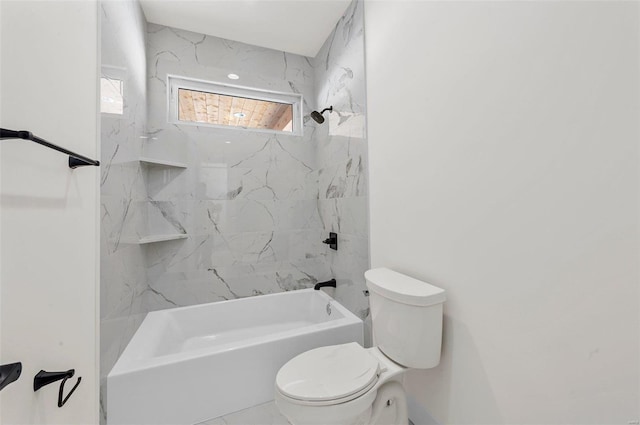 bathroom with tiled shower / bath combo and toilet