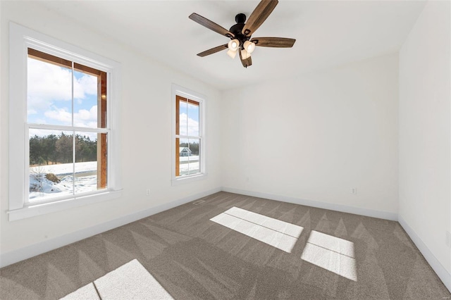 unfurnished room with carpet floors and ceiling fan