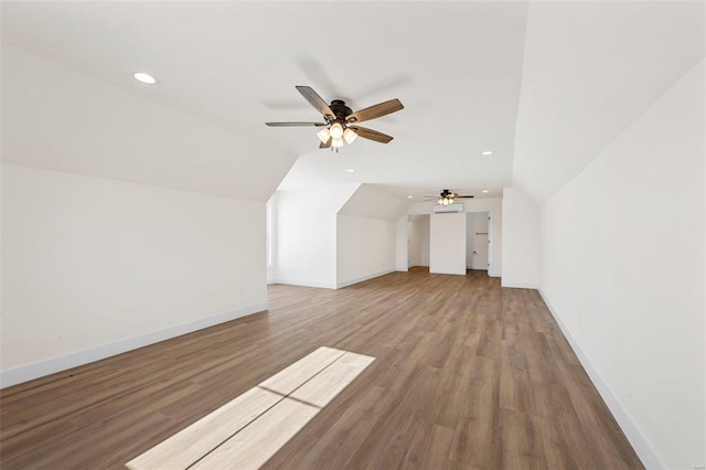 additional living space featuring lofted ceiling, ceiling fan, and wood-type flooring