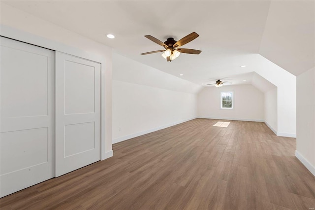 bonus room with ceiling fan, lofted ceiling, and hardwood / wood-style flooring