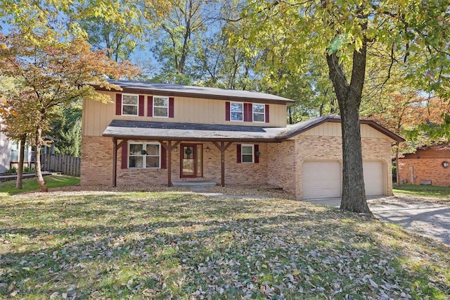 view of property with a front lawn and a garage