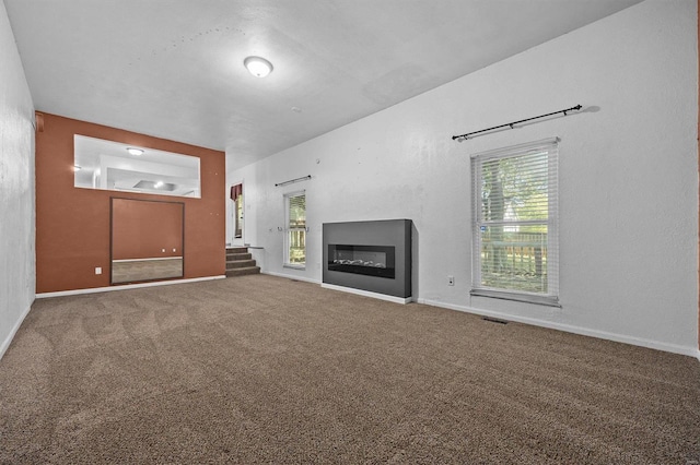 unfurnished living room with carpet