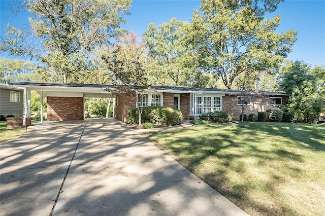 ranch-style home with a front yard and a carport