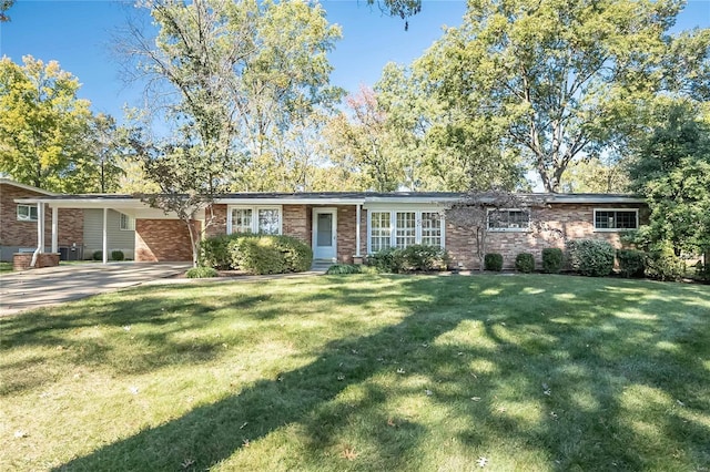 ranch-style house with a front lawn and a carport