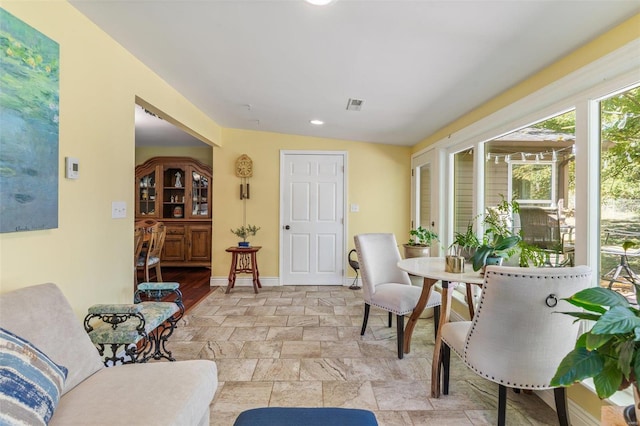 dining room featuring vaulted ceiling