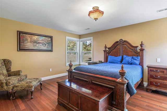 bedroom with hardwood / wood-style flooring