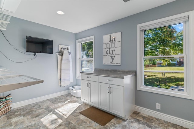 bathroom featuring vanity and a healthy amount of sunlight