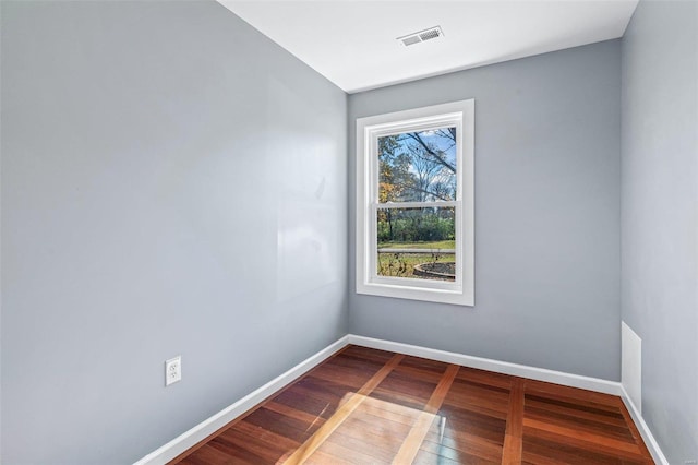 spare room featuring hardwood / wood-style floors