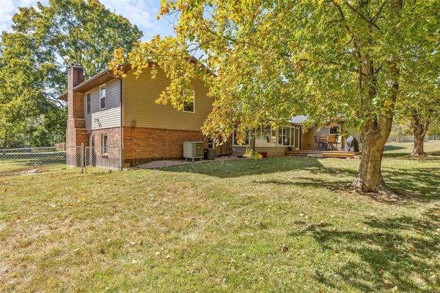 view of yard with a wooden deck and cooling unit