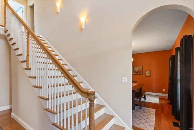 staircase featuring hardwood / wood-style floors