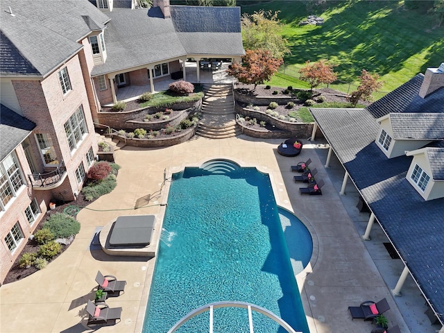 view of pool featuring a patio