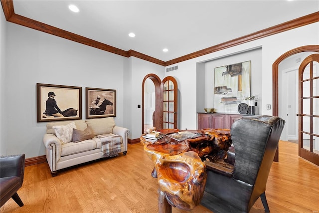 interior space featuring french doors, light hardwood / wood-style flooring, and ornamental molding