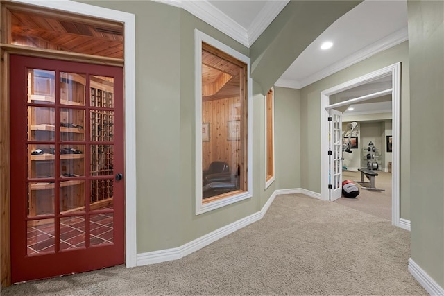 hall featuring carpet flooring and ornamental molding