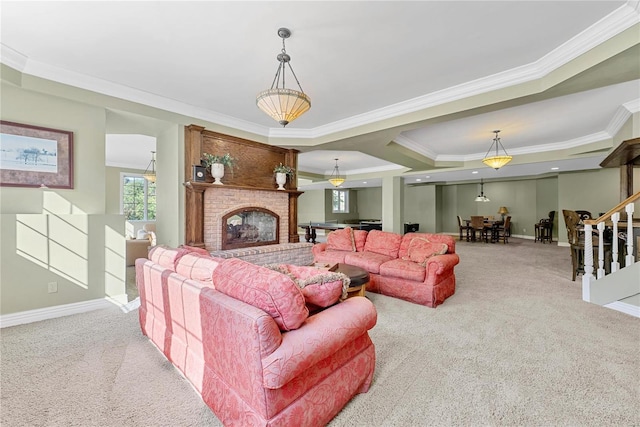 living room featuring a raised ceiling, crown molding, and light colored carpet