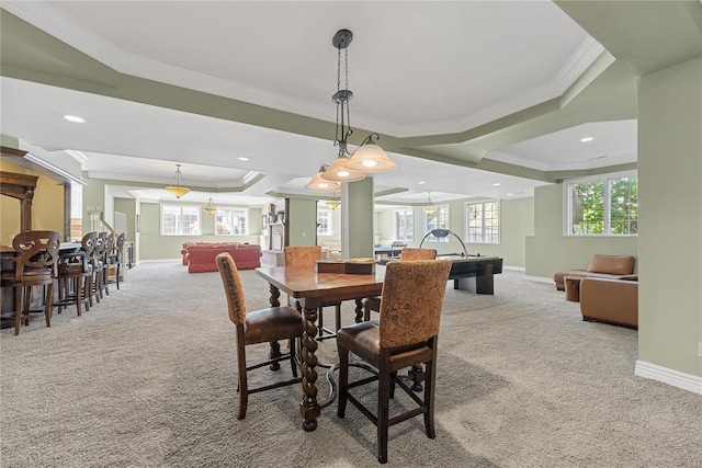 carpeted dining area featuring a raised ceiling, ornamental molding, and pool table