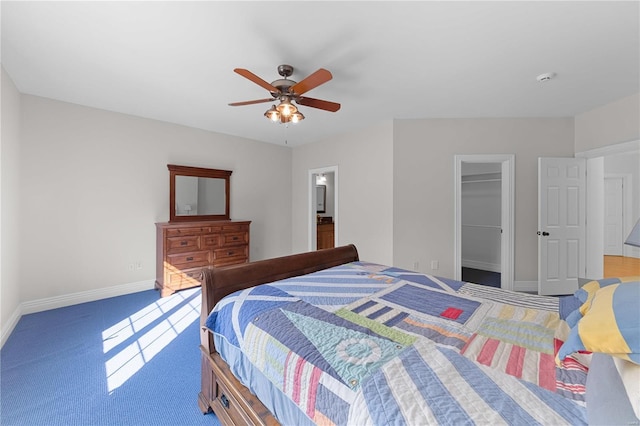 bedroom with ceiling fan, a closet, carpet floors, and a spacious closet