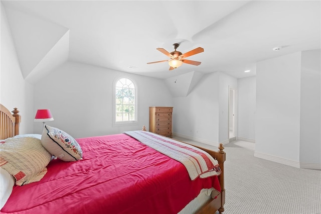 carpeted bedroom featuring vaulted ceiling and ceiling fan