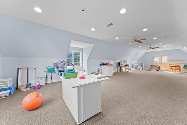 game room featuring ceiling fan, lofted ceiling, and light carpet