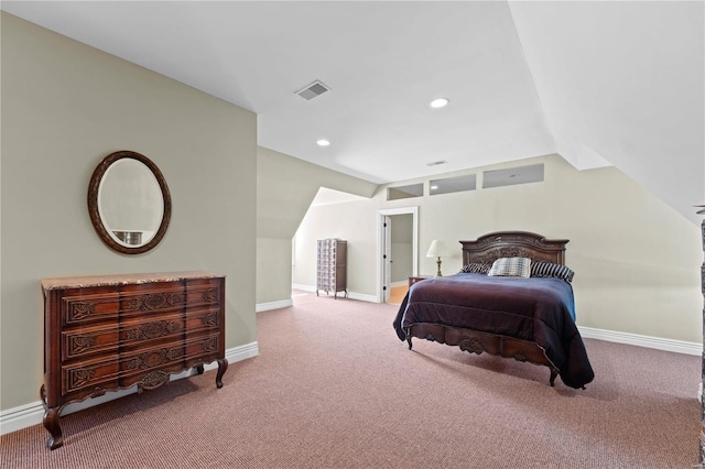 carpeted bedroom with lofted ceiling