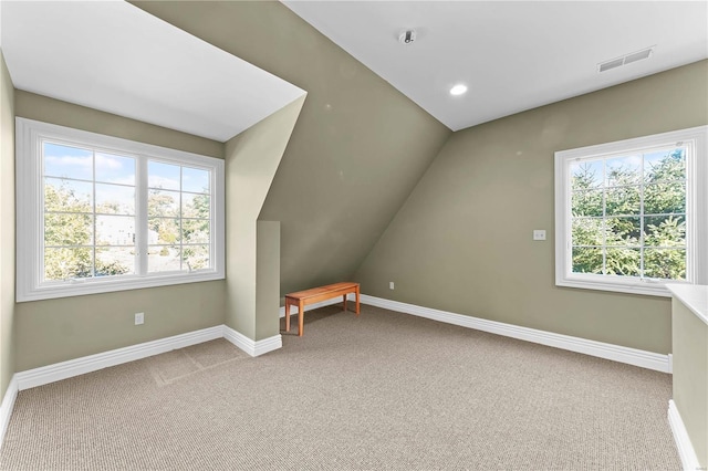 bonus room featuring carpet flooring and lofted ceiling