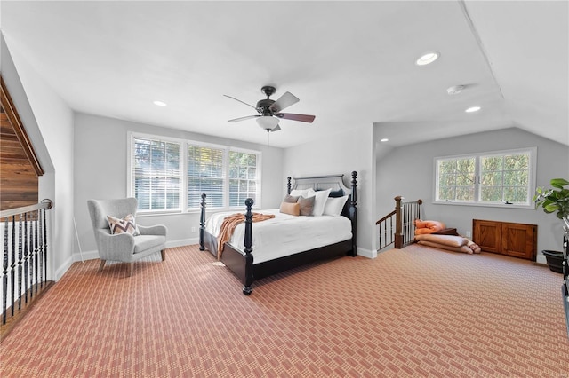 carpeted bedroom featuring ceiling fan and vaulted ceiling