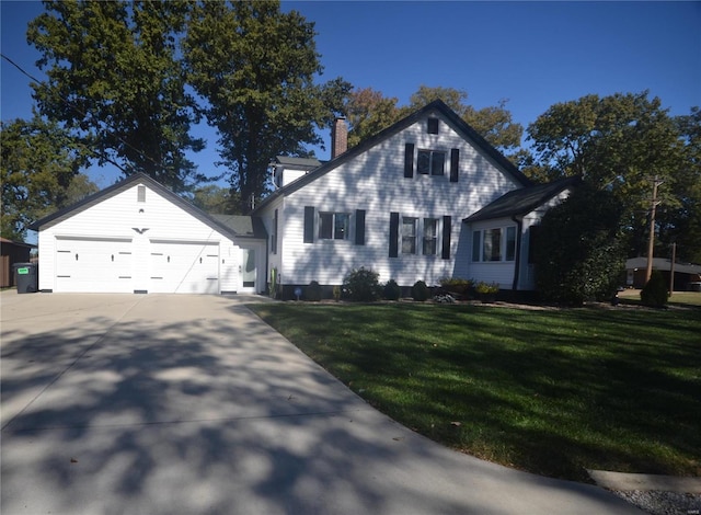 view of front of house featuring a garage and a front lawn