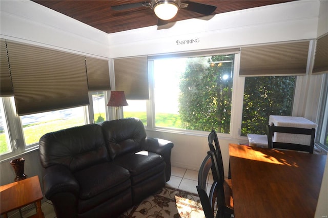 living room featuring ceiling fan and light tile patterned floors