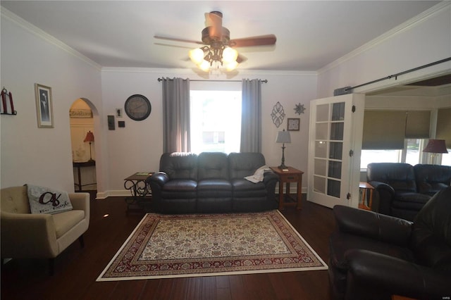 living room featuring ornamental molding, dark hardwood / wood-style floors, and ceiling fan