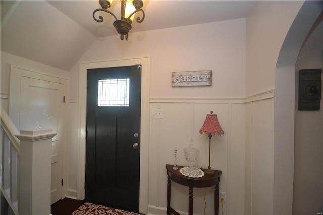 entrance foyer with vaulted ceiling