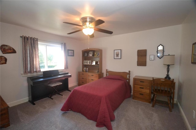 bedroom featuring light colored carpet and ceiling fan