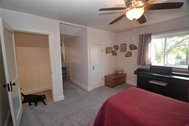 bedroom featuring light colored carpet and ceiling fan