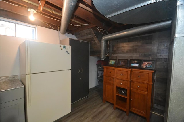 interior space featuring white fridge and dark hardwood / wood-style floors