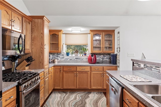 kitchen with backsplash and stainless steel appliances