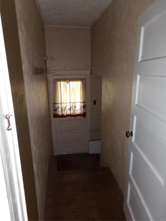 hallway with dark hardwood / wood-style floors