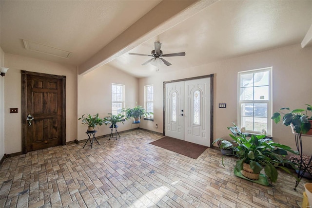 entrance foyer with ceiling fan and lofted ceiling with beams