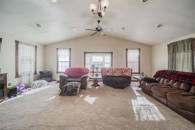 living room with carpet, ceiling fan with notable chandelier, and lofted ceiling