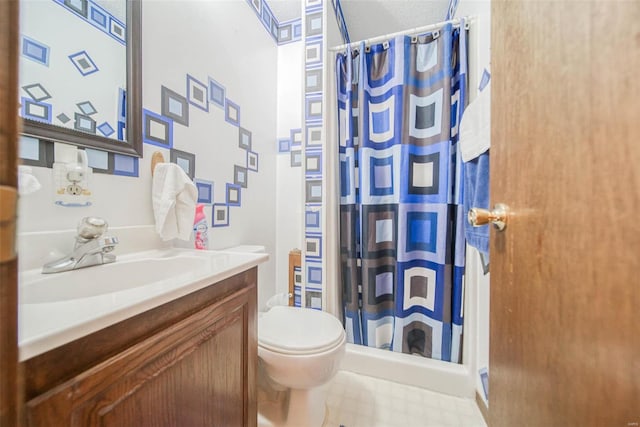 bathroom featuring vanity, toilet, and curtained shower