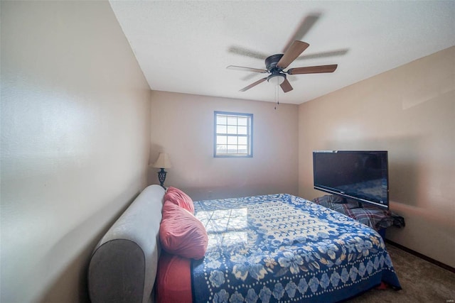 bedroom with dark carpet and ceiling fan