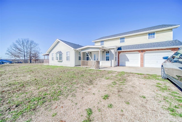 single story home featuring a porch and a garage