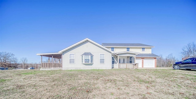 view of front of house with a garage and covered porch