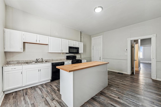 kitchen featuring sink, black appliances, white cabinets, and butcher block counters