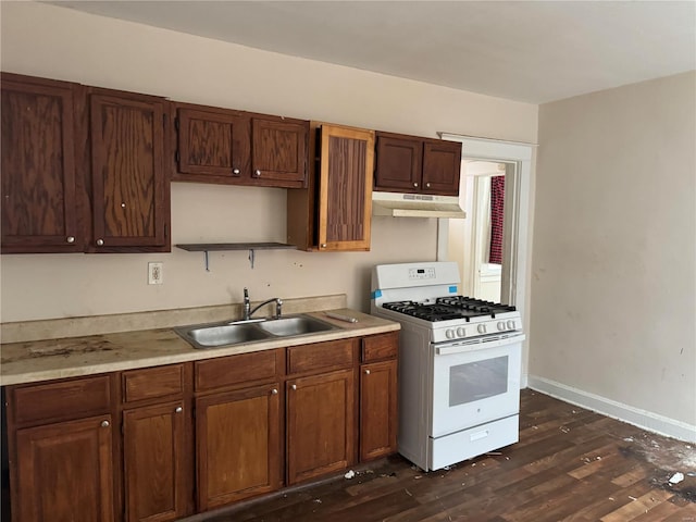 kitchen with dark hardwood / wood-style floors, sink, and gas range gas stove