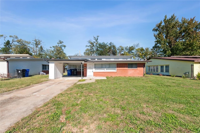 view of front facade with a carport and a front yard