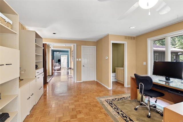 office area featuring ceiling fan, light parquet flooring, and ornamental molding