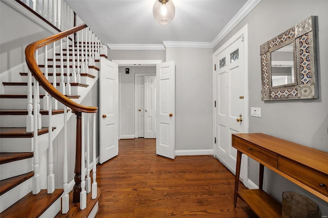 foyer entrance featuring dark hardwood / wood-style floors and ornamental molding