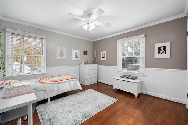 bedroom with dark hardwood / wood-style floors, ceiling fan, and crown molding