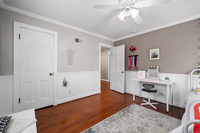 bedroom featuring ceiling fan, dark hardwood / wood-style floors, and ornamental molding