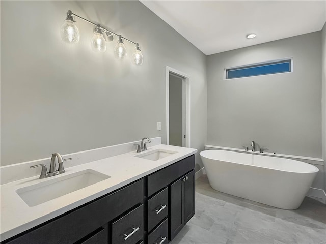 bathroom featuring vanity and a bathtub